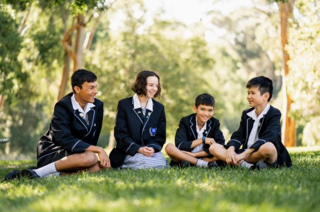 5 Private School Trends in Australia. Children sitting together on the grass.