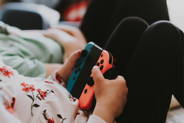 managing your child's screen time. child on gaming device.